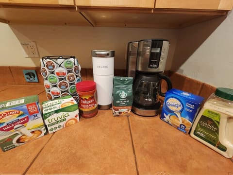 Coffee maker, Keurig, K-cups, and supplies for your morning routine.