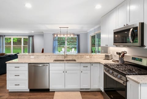 Kitchen includes gas range/oven, dishwasher, built-in microwave and fridge