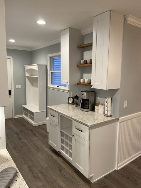 Entry area from garage with coffee bar, large stocked pantry