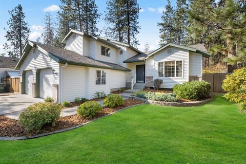 Whispering Pines Post Falls. Driveway has room for 4 cars, plus RV parking on left. Hope to welcome you soon!