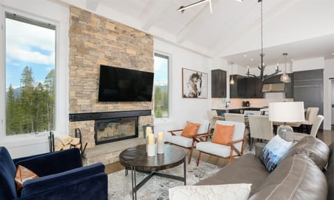 Wood burning fireplace and Smart TV in main floor living room