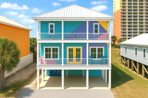 Bold pastel beach house on stilts with double balconies near the shore!