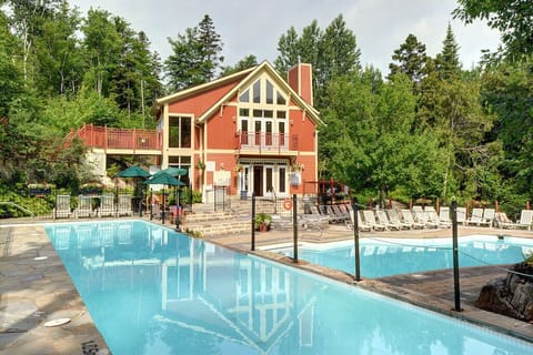 Seasonal outdoor pool, open 10:00 AM to 10:00 PM, pool umbrellas