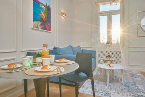 Deluxe Apartment | Living area | 85-cm LCD TV with cable channels, TV