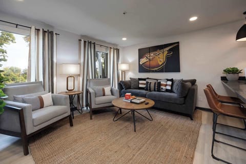 Stylish and inviting space with vibrant art and sunny views, perfect for relaxation!