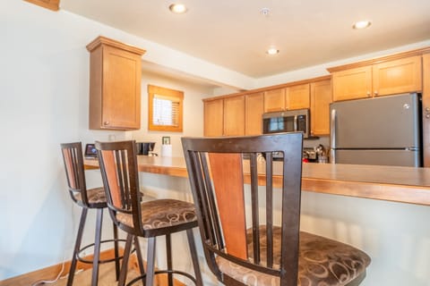 Breakfast bar with seating for three.