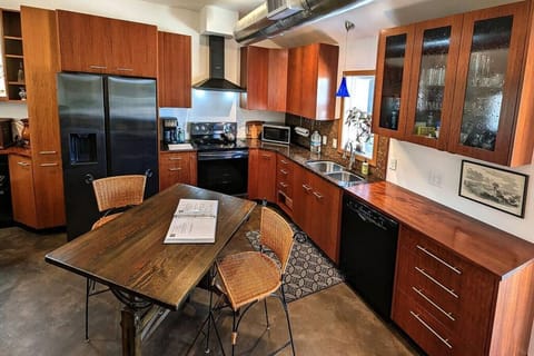 Custom Mahogany Cabinets, stocked with all your cooking needs — pans, casserole/pie/cake cookware, silverware, dishes (day & evening), glasses & stemware. And, room to move around.