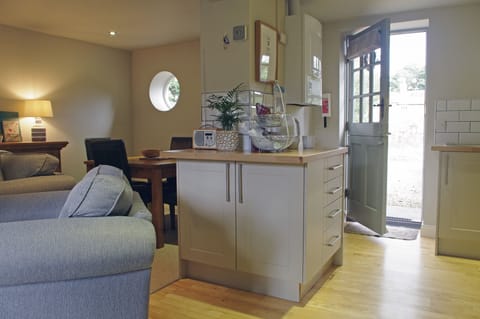 Beautiful lounge with dining and kitchen area at The Hay Loft in Bishopton, Ripon