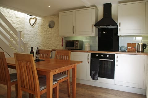 Kitchen with dining area at Forge Cottage in Masham
