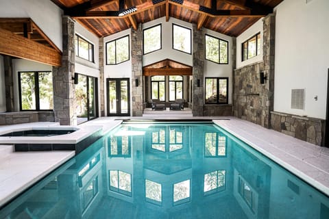 Swim year-round in your private indoor pool with vaulted ceilings and retractable doors to the patio.
