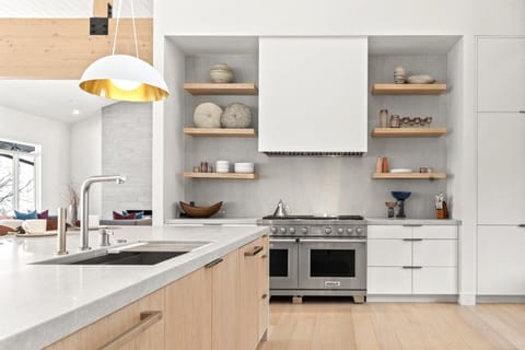 Modern Minimalist Kitchen Featuring Sleek Wood and Neutral Accents.