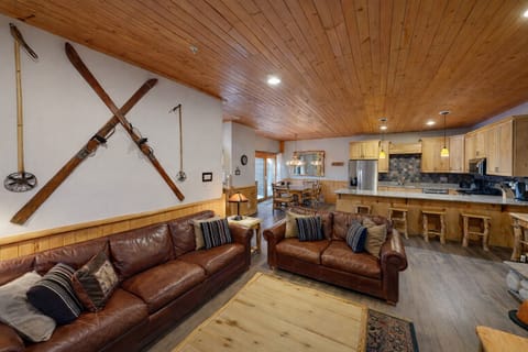 Cozy up in your rustic mountain retreat with rich leather sofas and a gourmet kitchen perfect for après-ski gatherings.