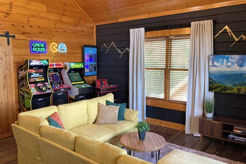 Newly updated game room with arcade games to suit everyone's interests and a large couch for enjoying your favorite streaming movies