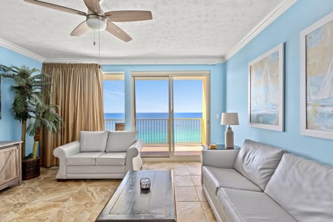 Relax in this coastal living room with ocean views and natural light.