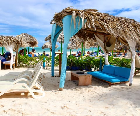 Private beach, white sand, sun loungers, beach umbrellas