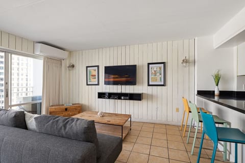 Bright living room w/ comfy seating & warm coastal touches for easy lounging.
