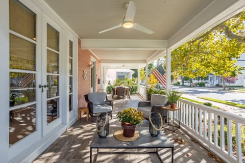 Lovely Front Porch with plenty of comfy seating and dining.
