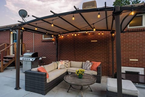 Cozy nights with BBQ, string lights & lounge seating.