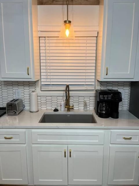 The kitchen has a drip coffee pot combo with K- cup 