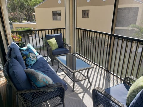 Lanai with ceiling fan and screened in area.