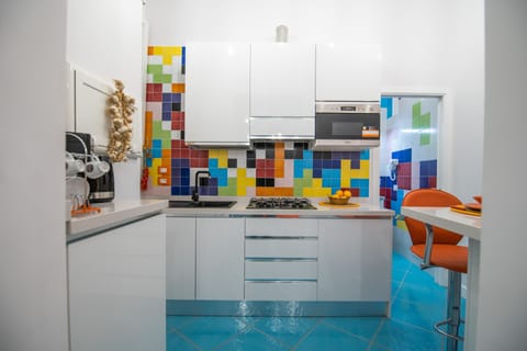 Deluxe Condo | Private kitchen | Fridge, microwave, oven, stovetop