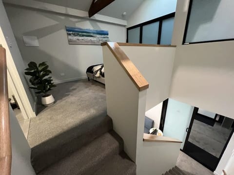 Stairs from living area to upstairs bedroom