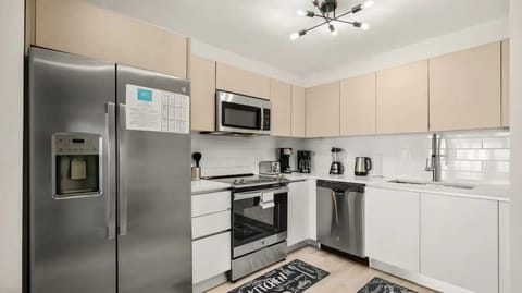 Kitchen view. All brand new and stainless steel appliances.