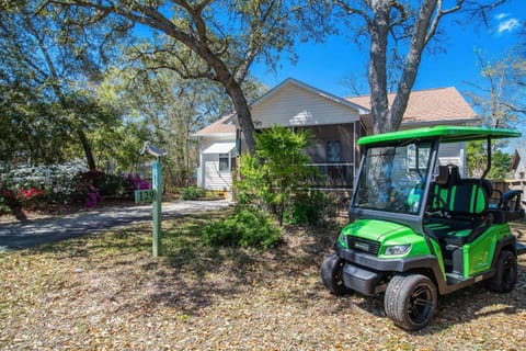 Located in the beautiful, quiet wooded section of Oak Island, Co'Sea Cottage has a Golf Cart for all your exploring & beach going.