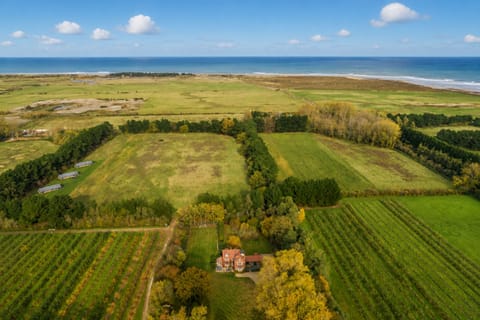 Holmbush, Thornham: Surrounded by orchards with the sea in the distance