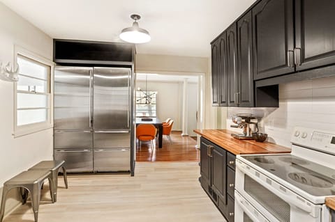 Full size fridge and freezer provides plenty of storage for your food.