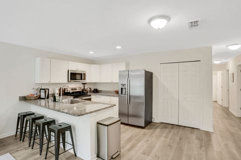 Full sized kitchen and refrigerator.