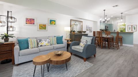 Living room with bright and modern furniture including a queen size sleeper sofa