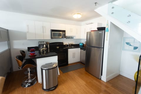 Full kitchen with extra seating at breakfast bar.