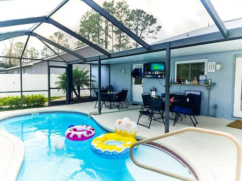 Relax & watch outdoor TV in the backyard