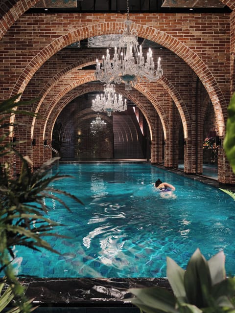 Indoor pool, seasonal outdoor pool, pool umbrellas, sun loungers