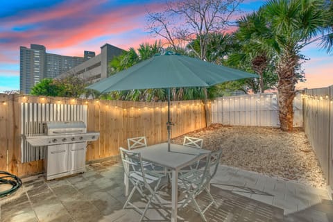 This secluded fenced area offers the ultimate outdoor retreat, featuring a hot tub for unwinding, a grill for cookouts, and plenty of space to gather and enjoy quality time together.