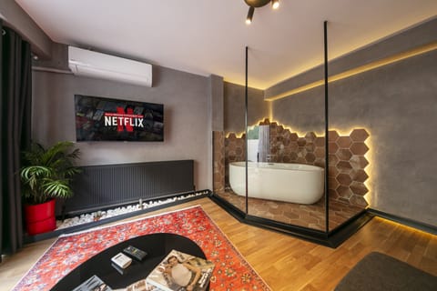 Romantic Studio Suite, 1 Queen Bed with Sofa bed, Garden View | Bathroom | Hair dryer, slippers, towels, soap