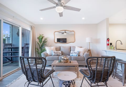 living room with pull-out sofa, patio