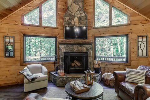 'Make Your Mark' features a wood-burning fireplace overlooking forest area
