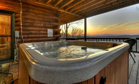 Relax in the hot tub with breathtaking views and peaceful surroundings.