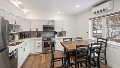 Open concept kitchen and dining area with seating for 6.