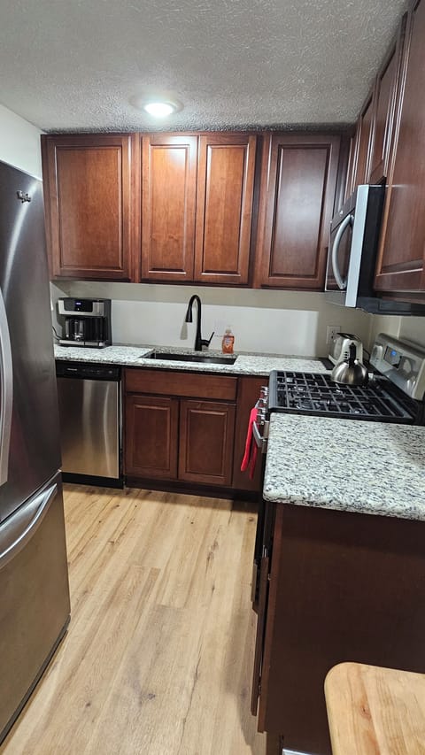 Kitchen -renovated in June 23 with new floors, cabinets, counters and appliances