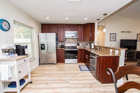 Open kitchen area with new stainless steel appliances!