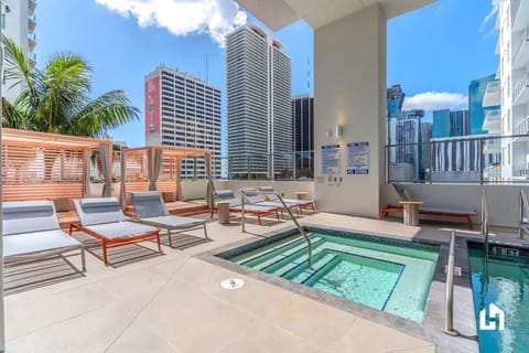 Access to the rooftop pool and jacuzzi, while enjoying open-air city views.