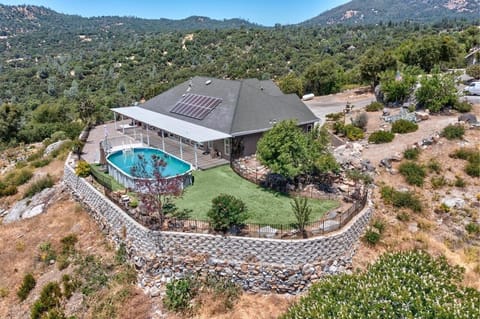 Escape to a tranquil oasis nestled on a hilltop, surrounded by stunning views.