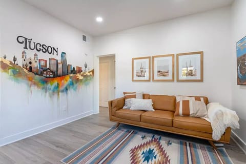 Living Room with Article sofa and collection of art showcasing Arizona. 🌵