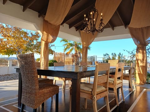 Outdoor firetable with camp fire in the middle seats up to 16 people. 
