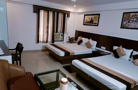 Family Room ( A/C ) | In-room safe, desk, free WiFi, bed sheets