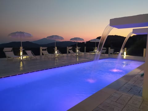 Seasonal outdoor pool, open 8:00 AM to 8:00 PM, pool umbrellas