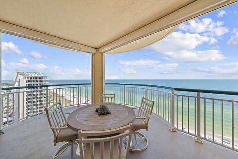 Beach Colony T15B- Step onto your private balcony and take in sweeping ocean views stretching endlessly to the horizon. Relax at the outdoor dining table, breathe in the salty breeze, and savor your morning coffee with the sound of waves below.